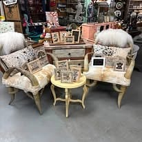 Vintage chairs, side tables and home decor inside Edge of Town